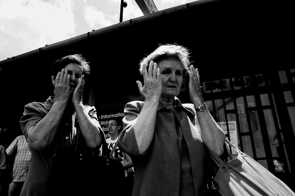 Woman in Sarajevo mourning for the victims Srebrenica whose coffins are being transported through he city centre before being taken to the graveyard.