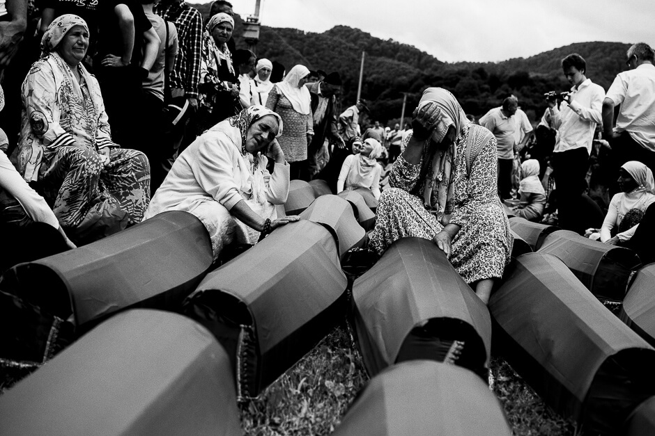 Mothers and grandmothers mourning newly identified victims of genocide in at the Srebrenica Potočari Memorial site.