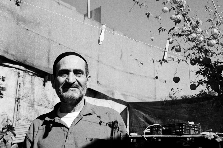 A Palestinian man in his garden in the East Jerusalem neighborhood called Silwan, a hotspot for the recent Intifada.