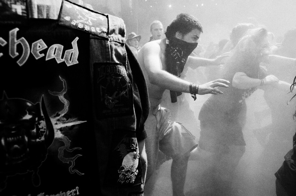 Metal fans in the dusty mosh pit at Wacken Open Air.