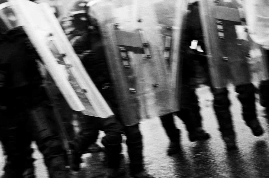 PSNI riot squad chasing protesters on the 12th of July in Ardoyne/Belfast.