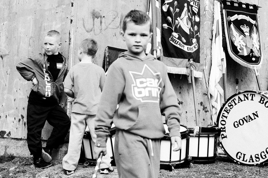 Young Protestant supporters during a pre-parade church service on Denmark Street/Shankill area in Belfast.