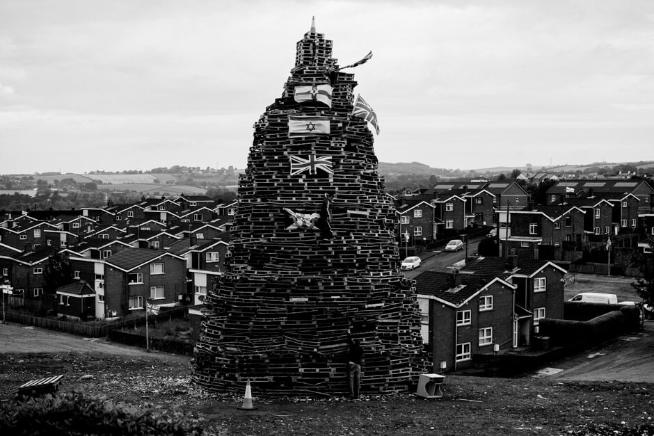 Bonfire decorated with Union Jack, Northern Ireland and Israel flag in Newtownards.